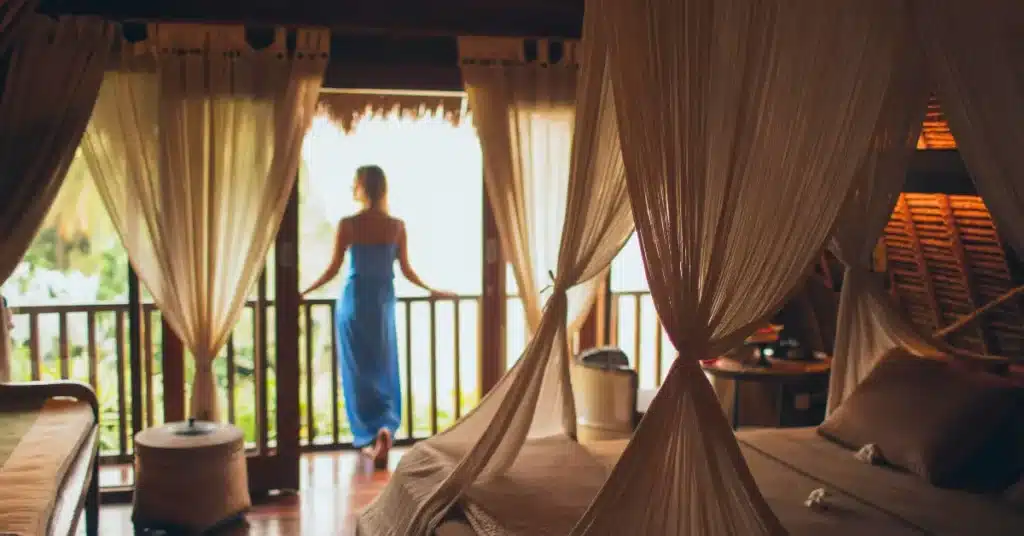 Woman on a beach vacation, back facing the ocean view, symbolizing freedom of choice in corporate gifting.
